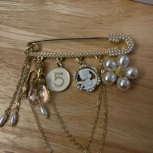 Elegant Gold and Pearl Charm Brooch